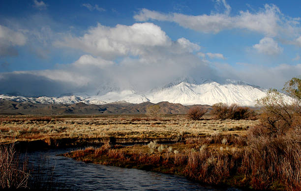 Owens River in Winter Early morning reflections of the eastern Sierra Nevada Mountains near Bishop California.  owens river stock pictures, royalty-free photos & images