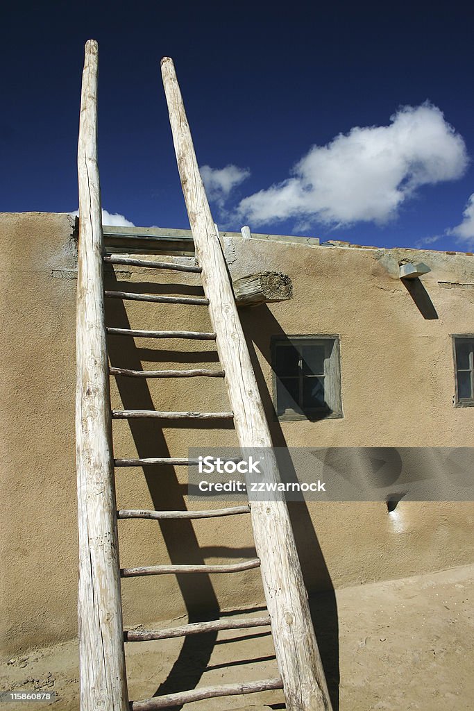 ladder in indian pueblo ladder on adobe house on indian pueblo in New Mexico Adobe - Material Stock Photo