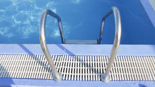 istock Rattan Sun Umbrella on swimming pool 1158611378