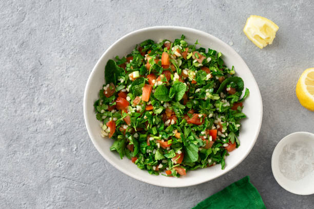istock Healthy summer tabule salad bowl top view copy space 1158615153