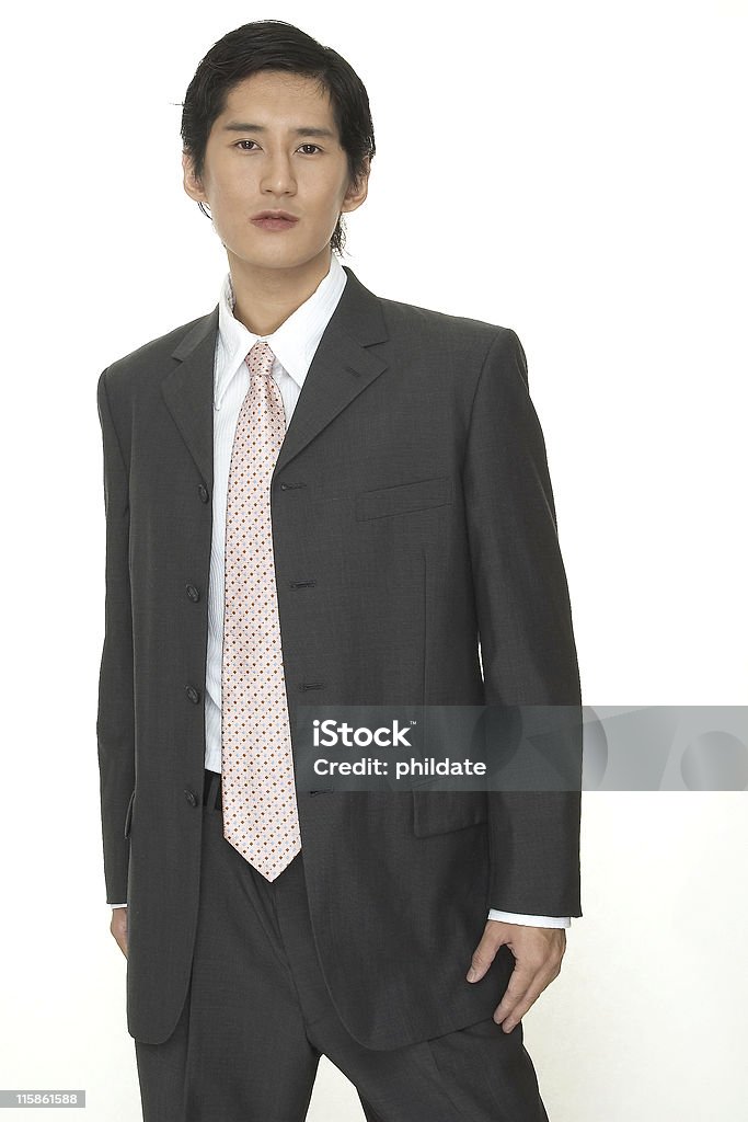 Businessman 16 An asian businessman in a smart grey suit with pink tie Adult Stock Photo
