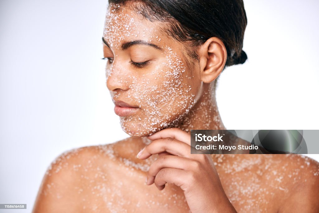Do your know the benefits of using salt for your skin? Studio shot of a beautiful young woman using sea salt in her beauty routine Exfoliation Stock Photo