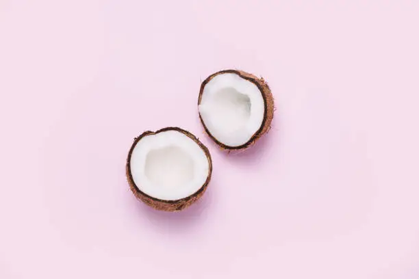 Coconut on pink background. Minimal concept. Top view, flat lay