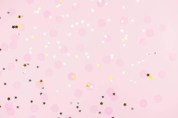 istock Pink confetti and stars and sparkles on pink background. 1158618430
