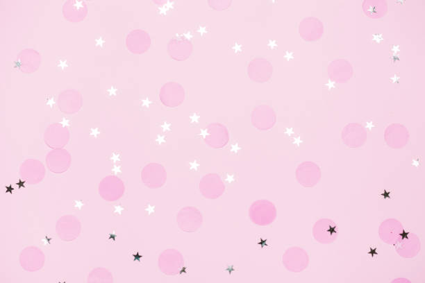 istock Pink confetti and stars and sparkles on pink background. 1158618437