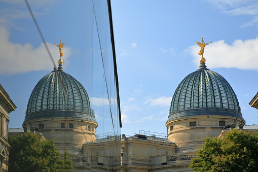 Academy of Fine Arts main building's glass dome with Pheme or Fama on its top.