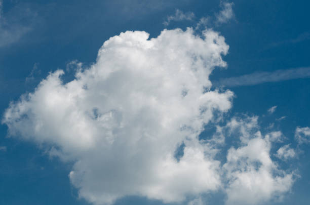 istock Incredibly wonderful lush cumulus clouds against a blue sky 1158619676