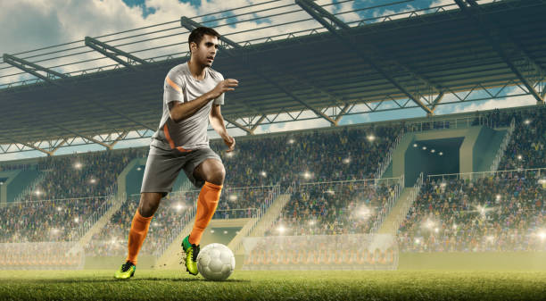 istock Soccer player in action on professional soccer stadium. 1158619679