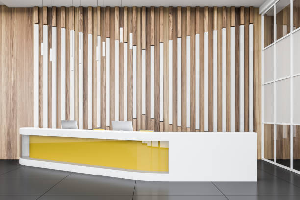 istock Wooden office hall with yellow reception desk 1158621095