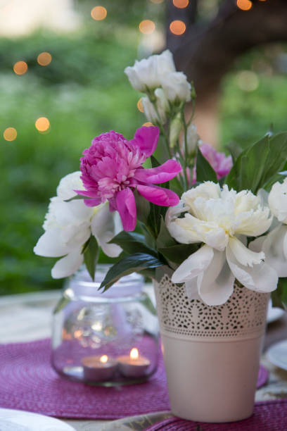 istock Candlelight jar and flower bouquet 1158622268