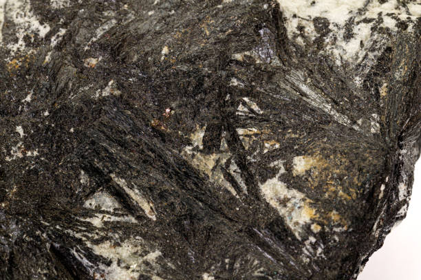 istock Macro stone Aegirine in charoite on white background 1158622473
