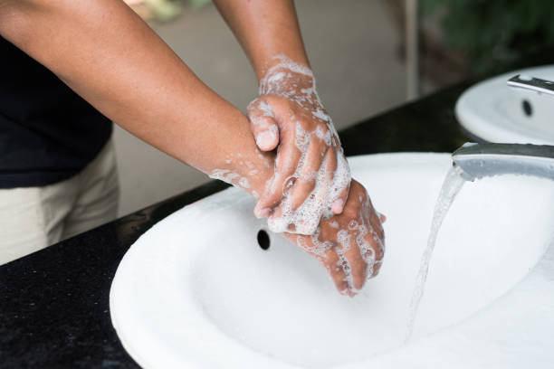 istock Man washing hands with soap. 1158623431