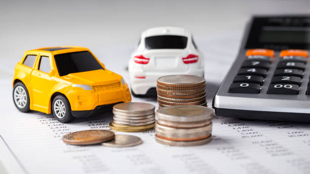 istock Cars, coins and calculator 1158624919