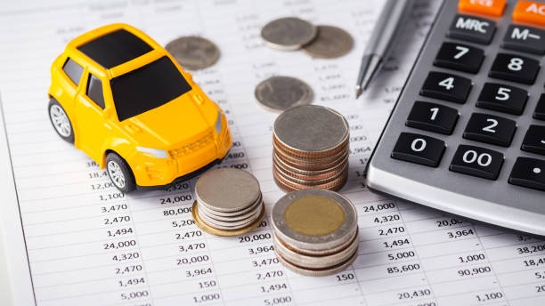 istock Car and money with calculator 1158625058