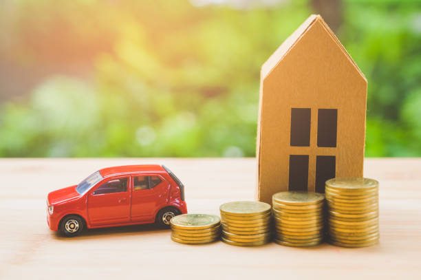 istock Saving money concept. Buy car, house, stack of coins. 1158626629