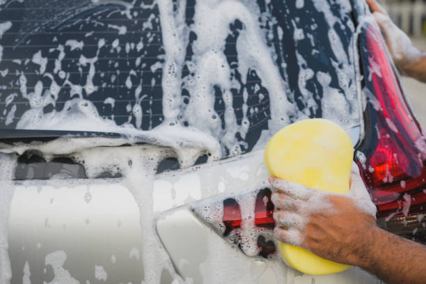 istock Rear view man worker washing car 1158626812