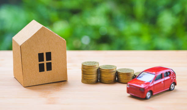 istock Saving money concept. Buy car, house, stack of coins. 1158627151