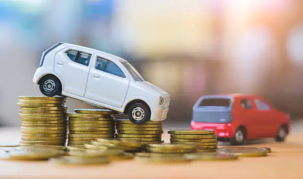 Photo of Car and stack of coin. Saving money for car concept. Car finance, buy car new concept.