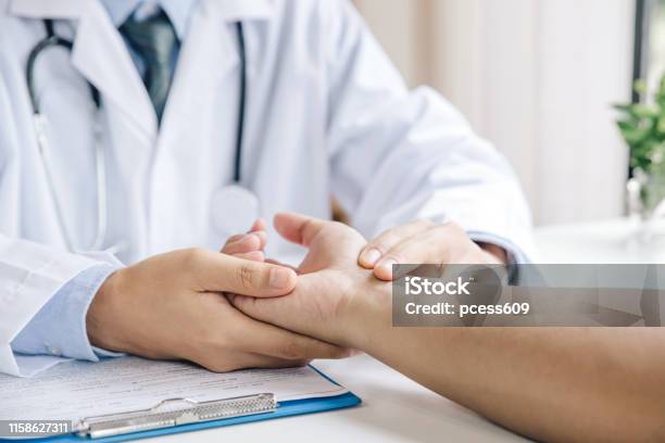 Extreme Closeup Of A Doctor Examining Patients Hand In The Medical Office Stock Photo - Download Image Now