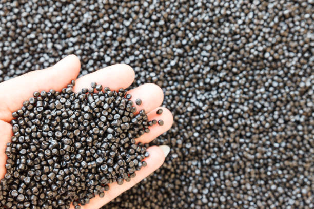 istock Close-up of plastic polymer granules. hand hold Polymer pellets. polymer plastic. compound polymer. 1158627369