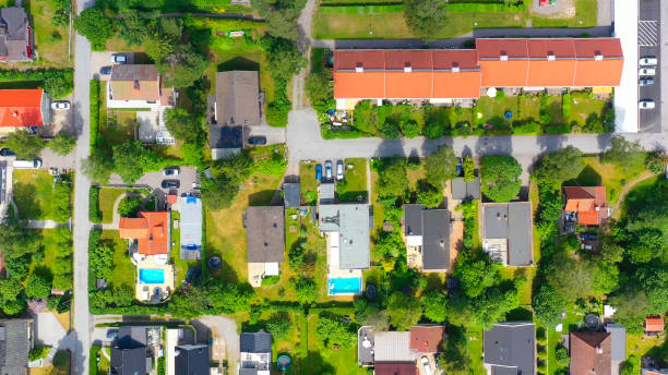 istock Top view, flying over idyllic villa area 1158628171