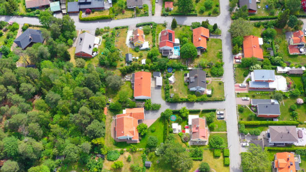 istock Top view, flying over idyllic villa area 1158628199