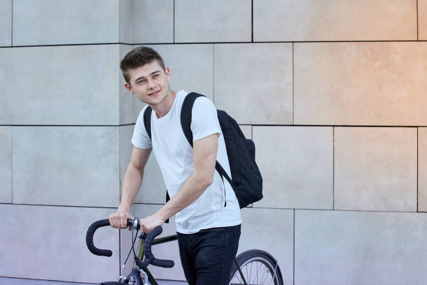 istock Handsome hipster man posing with bicycle in the city. 1158628293