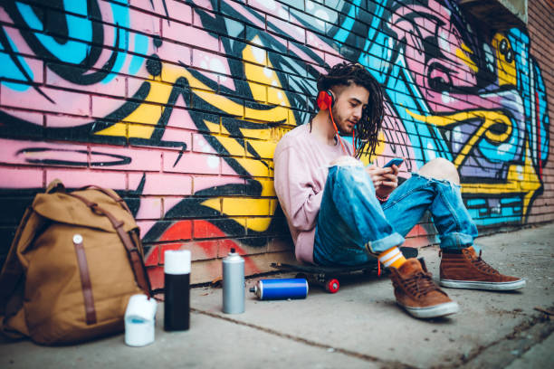 istock Graffiti artist listens to music 1158628568