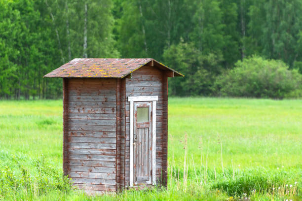 istock Lonely barn in green field and forest. 1158632222