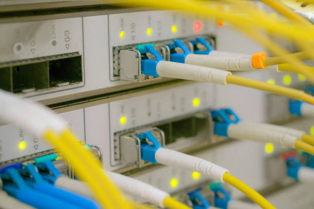 istock Many yellow internet cables. Front panel of the central router with a set of optical links is in the server room of the data center. Optical fiber wires are connected to high-speed interfaces. 1158632368