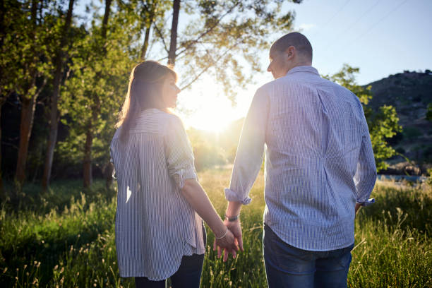 istock Couple walking through the field 1158632461
