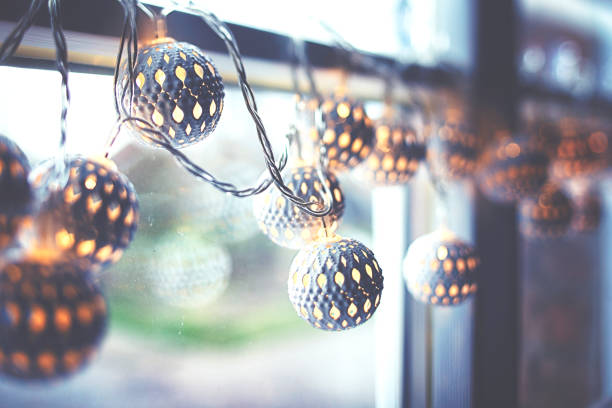 White pretty christmas lights on the window