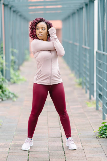 istock Female athlete warming up for sports practicing 1158633989