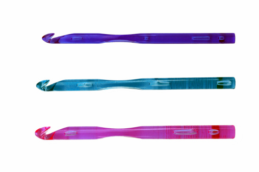 Brightly colored acrylic crochet hooks.