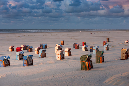 Germany, Lower Saxony, East Frisia, Juist, beach chairs in the evening light.