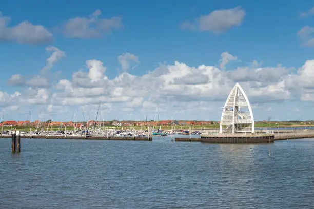 Germany, Lower Saxony, East Frisia, Juist, view to the pier and the marina with the sea sign.