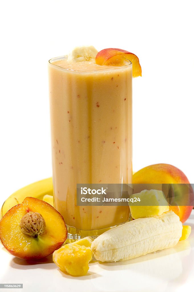 An exotic smoothie with apricots, mangos, and bananas Peach, Mango, &amp; Banana Smoothie Smoothie Stock Photo