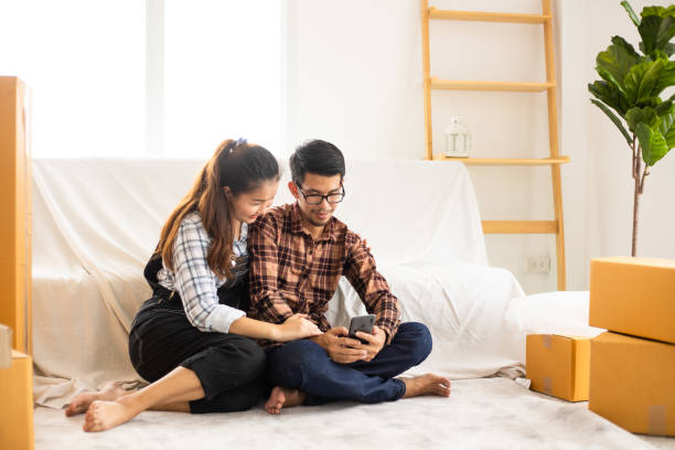 istock Asian couple in new home 1158637991