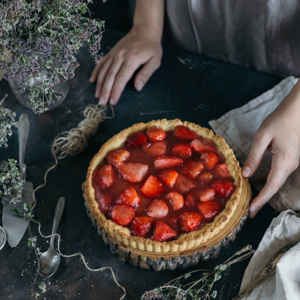 istock On the dark table strawberry pie on sand dough. 1158638760