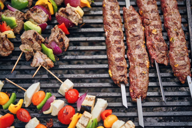 istock Preparing Lamb and Beef Kebab on BBQ Grill 1158640205