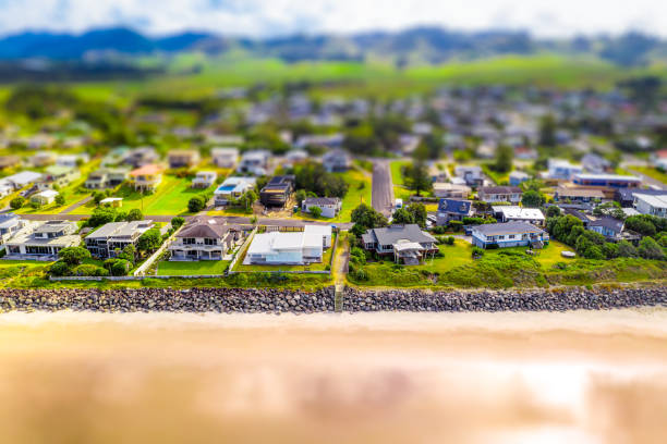 Tilt-Shift Beach Houses An aerial tilt/shift view of holiday houses on the beachfront at Waihi Beach on New Zealand's Coromandel Peninsula. coromandel peninsula stock pictures, royalty-free photos & images