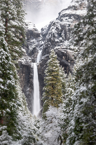 A Yosemite waterfall in the fog.