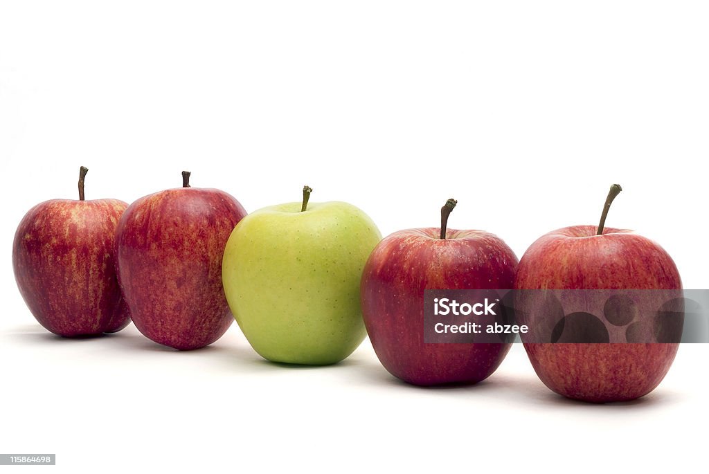 Odd one out Group of red apples with one green one Apple - Fruit Stock Photo