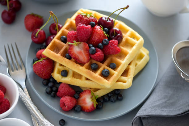 istock Homemade Belgian waffles with berries on gray table. Healthy breakfast concept. 1158648961