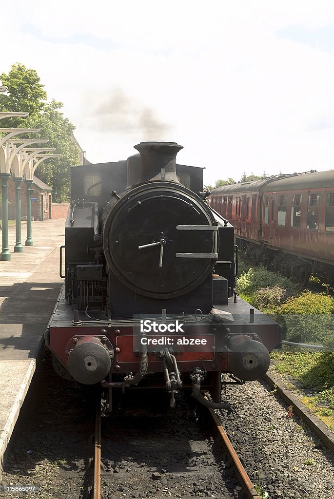 Steam Locomotive at Station A preserved British steam locomotive waiting at a station on the Caledonian Railway in Brechin, Scotland Bizarre Stock Photo