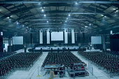 Dark blue-toned large empty auditorium hall