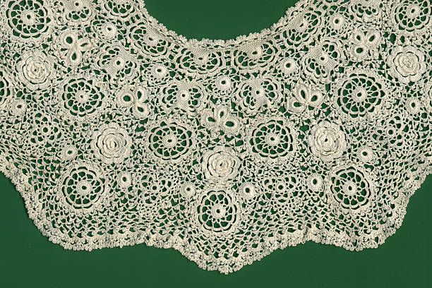 Irish crochet Antique Irish crochet collar. Motifs include roses, wheels, shamrocks and buttons. Circa 1900. Crochet stock pictures, royalty-free photos & images