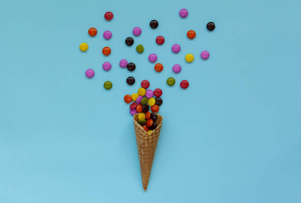 istock Waffle cone and heap colorful candy 1158660097