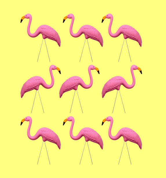 istock Pink Flamingos On A Yellow Background 1158667221