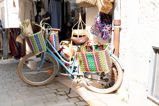 Fashion shop in street in Saint Martin in Ile de Re in France with beach cruiser bike